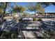 Community park with chess tables and benches under the shade at 18255 W Carlota Ln, Surprise, AZ 85387