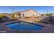 Private backyard oasis with sparkling pool and patio at 18668 W Chuckwalla Canyon Rd, Goodyear, AZ 85338