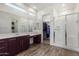 Modern bathroom with double vanity, walk-in shower, and large closet at 18668 W Chuckwalla Canyon Rd, Goodyear, AZ 85338