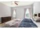 Comfortable bedroom with king-size bed and dresser at 18668 W Chuckwalla Canyon Rd, Goodyear, AZ 85338
