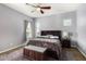 Spacious bedroom with a king-size bed and ceiling fan at 18668 W Chuckwalla Canyon Rd, Goodyear, AZ 85338