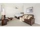 Spacious bedroom with a comfortable couch and a desk at 18668 W Chuckwalla Canyon Rd, Goodyear, AZ 85338