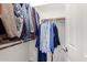 Well-organized closet with hanging clothes and shelves at 18668 W Chuckwalla Canyon Rd, Goodyear, AZ 85338