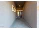 Front entry with tile flooring and a wooden door at 18668 W Chuckwalla Canyon Rd, Goodyear, AZ 85338