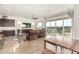 Spacious living area with hardwood floors and access to a patio at 18668 W Chuckwalla Canyon Rd, Goodyear, AZ 85338