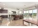 Spacious living area with hardwood floors and access to a patio at 18668 W Chuckwalla Canyon Rd, Goodyear, AZ 85338
