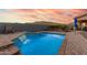 Stunning pool with waterfall feature and mountain views at 18668 W Chuckwalla Canyon Rd, Goodyear, AZ 85338
