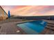 Enjoy this refreshing pool with waterfall feature and patio at 18668 W Chuckwalla Canyon Rd, Goodyear, AZ 85338