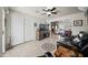 Living room with leather seating, TV, and view into adjacent living space at 2125 W Bromm Ln, Wickenburg, AZ 85390