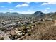 Aerial view showcasing the home, pool, and mountain views at 2716 E Voltaire Ave, Phoenix, AZ 85032