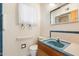 Small bathroom with blue sink and shower at 2716 E Voltaire Ave, Phoenix, AZ 85032