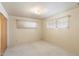 Simple bedroom with closet and two windows at 2716 E Voltaire Ave, Phoenix, AZ 85032