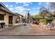 Brick patio with umbrella and seating area at 2716 E Voltaire Ave, Phoenix, AZ 85032
