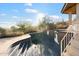 Damaged kidney-shaped pool needing repairs at 2716 E Voltaire Ave, Phoenix, AZ 85032