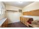 Workshop with wood cabinets and pegboard at 2716 E Voltaire Ave, Phoenix, AZ 85032