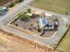 Aerial view highlighting a house with solar panels and a fenced backyard at 279 S Lyman Ct, Casa Grande, AZ 85194