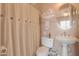 Clean bathroom with shower/tub combo and pedestal sink at 279 S Lyman Ct, Casa Grande, AZ 85194