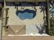Aerial view of a kidney-shaped pool and surrounding patio at 297 W Seaside Dr, Casa Grande, AZ 85122