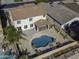 Aerial view showing house and kidney shaped pool at 297 W Seaside Dr, Casa Grande, AZ 85122