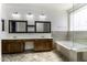 Spacious bathroom with double vanity, soaking tub, and walk-in shower at 297 W Seaside Dr, Casa Grande, AZ 85122