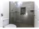 Bathroom with shower, toilet and tiled walls at 297 W Seaside Dr, Casa Grande, AZ 85122