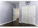 Bedroom with double doors and dark hardwood floors at 297 W Seaside Dr, Casa Grande, AZ 85122