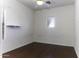 Bright bedroom with dark wood floors and ceiling fan at 297 W Seaside Dr, Casa Grande, AZ 85122