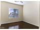 Bright bedroom with wood flooring and large window at 297 W Seaside Dr, Casa Grande, AZ 85122