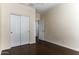 Bedroom with double door closet and wood flooring at 297 W Seaside Dr, Casa Grande, AZ 85122