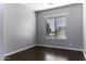 Simple bedroom with dark hardwood floors and window at 297 W Seaside Dr, Casa Grande, AZ 85122