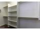 Walk-in closet with wooden shelves and hanging rods at 297 W Seaside Dr, Casa Grande, AZ 85122