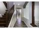 Clean entryway with wood staircase and tile flooring at 297 W Seaside Dr, Casa Grande, AZ 85122