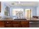 Kitchen island with granite countertops and view to Gathering room at 297 W Seaside Dr, Casa Grande, AZ 85122