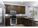 Kitchen with double oven, granite counters and island at 297 W Seaside Dr, Casa Grande, AZ 85122