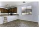 Kitchen with breakfast bar and tile flooring at 297 W Seaside Dr, Casa Grande, AZ 85122