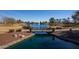 Photo of a tranquil lake with a bridge and fountain in a community setting at 297 W Seaside Dr, Casa Grande, AZ 85122
