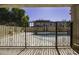 View of kidney shaped pool through gate at 297 W Seaside Dr, Casa Grande, AZ 85122