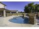 Kidney shaped pool with fountain and landscaping at 297 W Seaside Dr, Casa Grande, AZ 85122