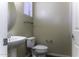 Clean powder room with pedestal sink and toilet at 297 W Seaside Dr, Casa Grande, AZ 85122