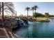 Picturesque waterfall and pond in community at 297 W Seaside Dr, Casa Grande, AZ 85122