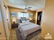 Bright bedroom with double bed and ceiling fan at 303 S Recker Rd # 175, Mesa, AZ 85206