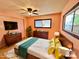 Bright bedroom with double bed, dresser, and large window at 303 S Recker Rd # 175, Mesa, AZ 85206