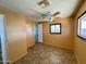 Simple bedroom with tile flooring, ceiling fan and window at 303 S Recker Rd # 175, Mesa, AZ 85206