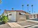 Mobile home with carport, palm trees and driveway at 303 S Recker Rd # 175, Mesa, AZ 85206