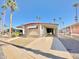 Tan mobile home with carport and palm trees at 303 S Recker Rd # 175, Mesa, AZ 85206