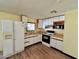 Efficient kitchen with white cabinets and appliances at 303 S Recker Rd # 175, Mesa, AZ 85206