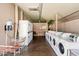 Clean laundry facility with multiple washers and dryers at 303 S Recker Rd # 175, Mesa, AZ 85206
