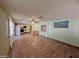 Open living area with laminate floors, kitchen, and dining area at 303 S Recker Rd # 175, Mesa, AZ 85206