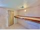 Small workshop with wood shelving and door at 303 S Recker Rd # 175, Mesa, AZ 85206