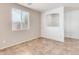 Spacious living room with tile floors and a view into the kitchen at 4962 E Amarillo Dr, San Tan Valley, AZ 85140